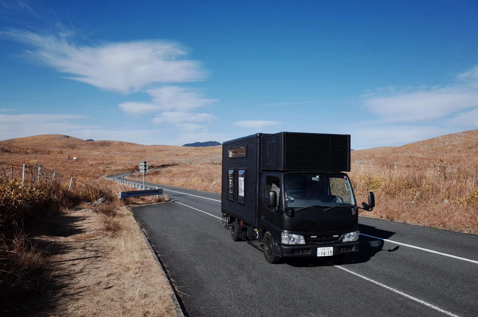 THE PACK WAGON driving on a winding road